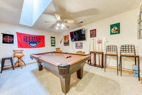 a room with a pool table and a ceiling fan at Clark's Mountain Condo in Welches