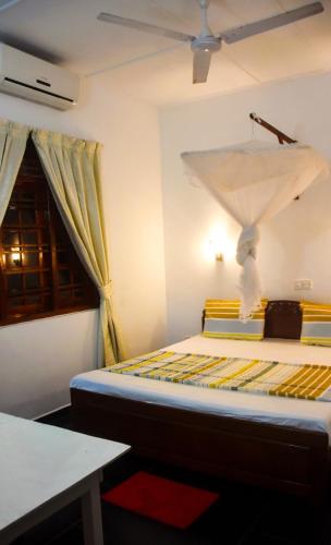 Postel nebo postele na pokoji v ubytování Mali Guest House