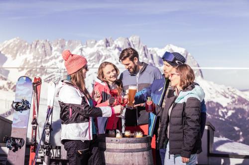 a group of people standing on top of a mountain at Tirol Lodge in Ellmau