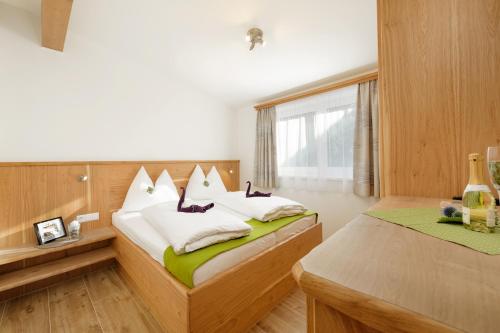 Postel nebo postele na pokoji v ubytování Appartement Mayrhofer - Ferienwohnungen