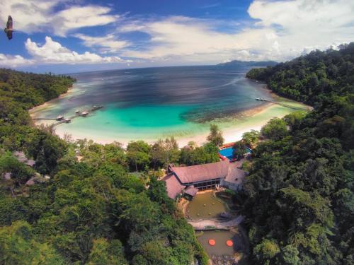 an aerial view of a beach with a resort at Bunga Raya Island Resort & Spa in Gaya Island
