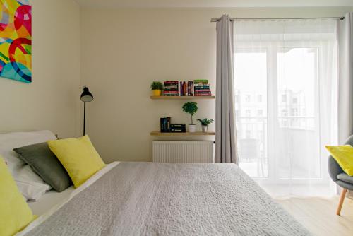 Apartamentylove - Apartament Więckowski, prywatny garaż podziemny opcjonalnieにあるベッド