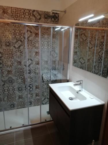 a bathroom with a sink and a shower at Cielo Alto I Dadi in Breuil-Cervinia