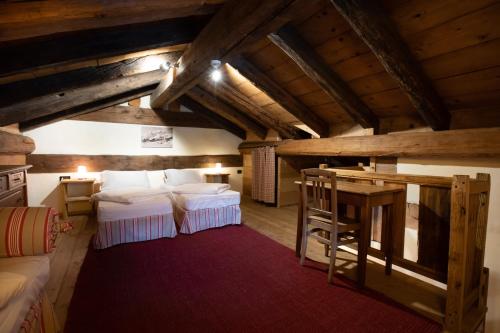 Postel nebo postele na pokoji v ubytování Chalet Svizzero