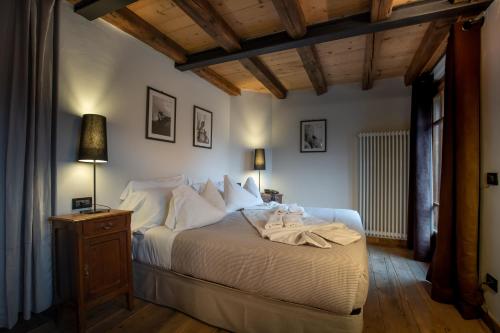 Postel nebo postele na pokoji v ubytování Chalet Svizzero