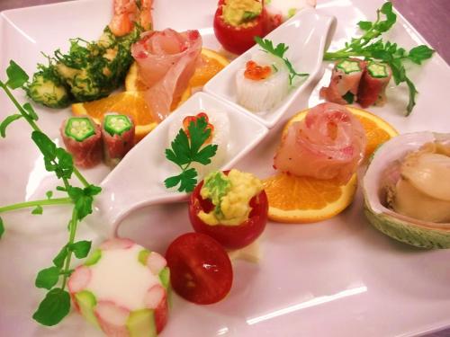 a white plate topped with different types of food at HOTEL W-PREMIUM -W GROUP HOTELS and RESORTS- in Koshigaya