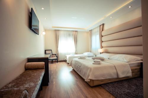Postel nebo postele na pokoji v ubytování Grand Lakes Rooms