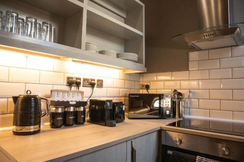 a kitchen counter with a coffee maker on it at York Street Studios in Liverpool