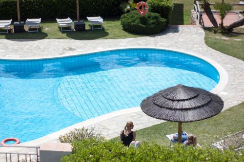 A view of the pool at Residence Le Bouganville or nearby