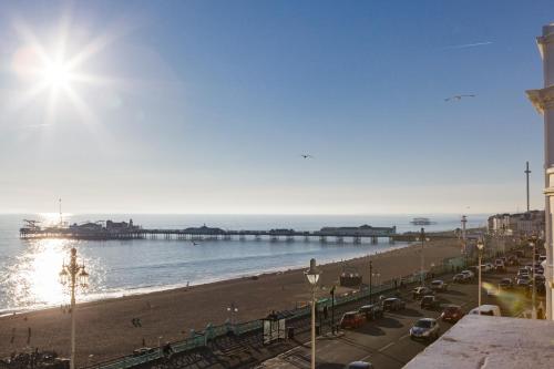 a view of a beach with a pier at Sea-facing Art Deco Apartment in Brighton & Hove