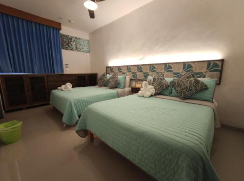 Postel nebo postele na pokoji v ubytování Kai Hotel