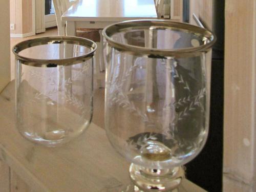 two clear glass vases sitting on top of a counter at 5 person holiday home in Rude in Rude