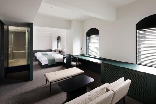 Postel nebo postele na pokoji v ubytování DDD HOTEL