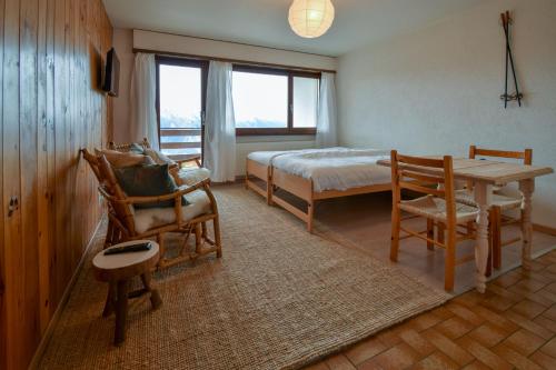 Säng eller sängar i ett rum på Apartment Mont-Parrain