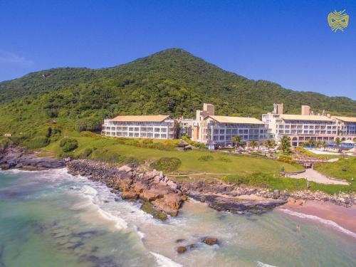 an aerial view of a resort on the beach at Costao do Santinho Resort All Inclusive in Florianópolis