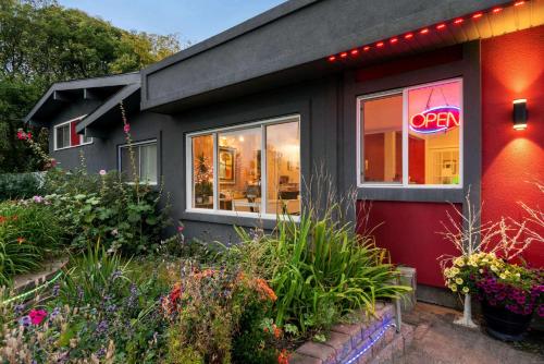 a house with a neon open sign in the window at Thriftlodge Edmonton in Edmonton