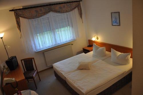 Кровать или кровати в номере Hotel Kirchner