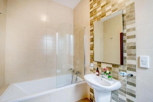 a bathroom with a sink and a shower and a toilet at Hillock Residence Apartments in Marsalforn