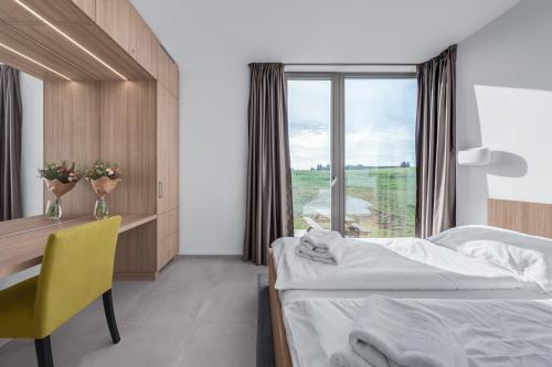 Postel nebo postele na pokoji v ubytování Apartmány HRÁDEČEK
