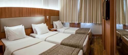 Cama o camas de una habitación en Hotel Astoria Copacabana