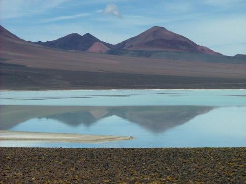 a large body of water with mountains in the background at Don Remo in Villa Unión