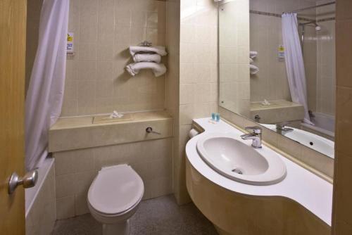 a bathroom with a toilet and a sink at Britannia Hotel Aberdeen in Aberdeen