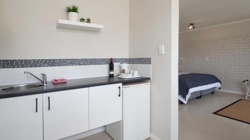 Η κουζίνα ή μικρή κουζίνα στο Interlaken Guest House