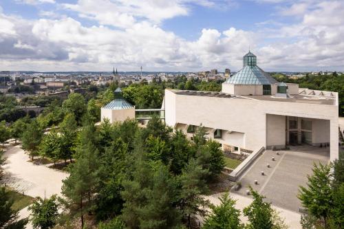 an aerial view of a white building with a tower at Melia Luxembourg in Luxembourg