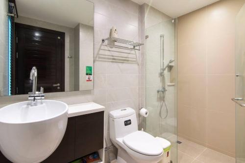 a bathroom with a sink and a toilet and a shower at Emerald Terrace Resort in Patong Beach