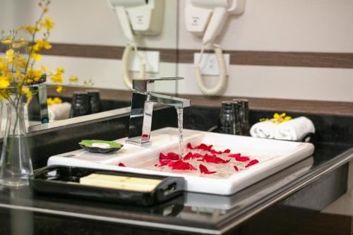 a kitchen sink with a faucet on a counter at Tam Coc Holiday Hotel & Villa in Ninh Binh