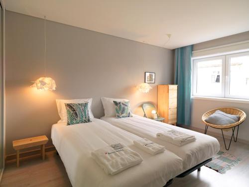 Postel nebo postele na pokoji v ubytování FLH Porto Trindade Cozy Flat