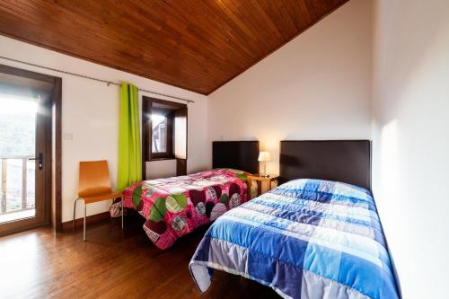 Ένα ή περισσότερα κρεβάτια σε δωμάτιο στο Casa da Mencha