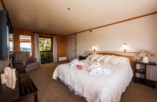 Un ou plusieurs lits dans un hébergement de l'établissement Hotel Elun, la mejor vista