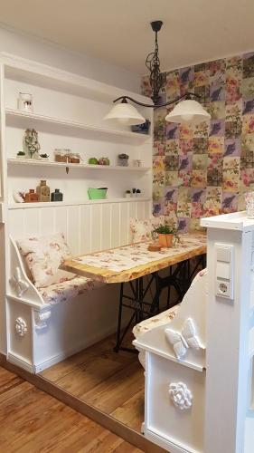 a room with a table and a table and shelves at Zucht- und Ausbildungsstall Rubly in Kleinbundenbach