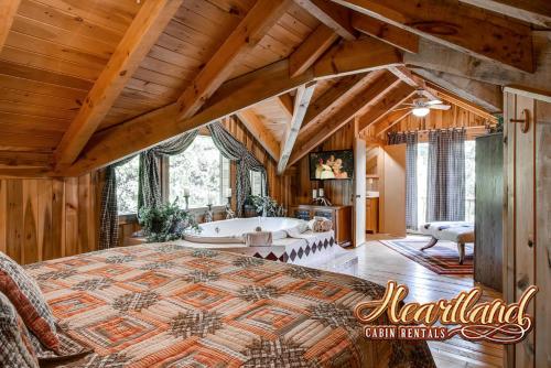 a bedroom with a large bed and a bath tub at Halfway to Heaven in Sevierville
