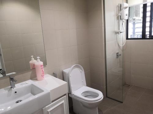 a bathroom with a toilet and a sink and a shower at Dz Studio and Suite Parisien Tower i-City in Shah Alam