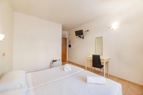 Ένα ή περισσότερα κρεβάτια σε δωμάτιο στο Hotel Villa Piras