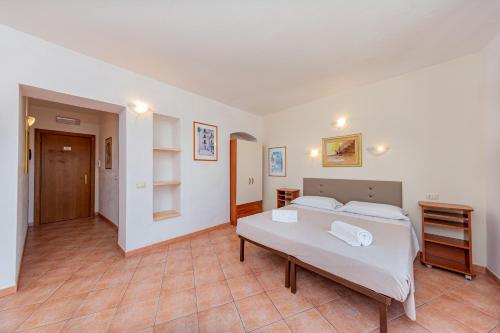 Ένα ή περισσότερα κρεβάτια σε δωμάτιο στο Hotel Villa Piras