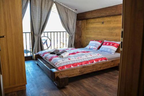 En eller flere senge i et værelse på Mountain Chalets Valča