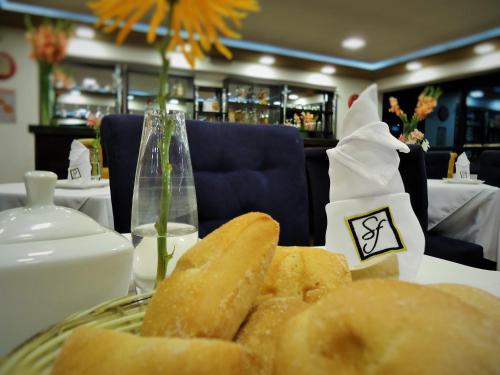 a plate of bread on a table in a restaurant at San Francisco Cusco Hotel in Cusco