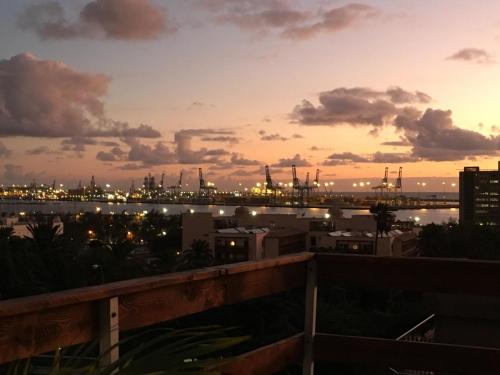 a view of a harbor at sunset at Casa Doramas VV in Las Palmas de Gran Canaria