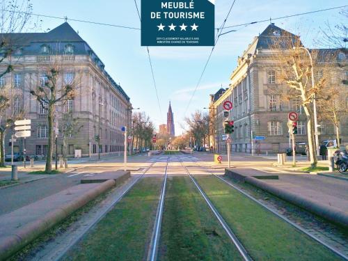 an empty street in a city with buildings at Avenue de La Paix - L'Exclusif in Strasbourg