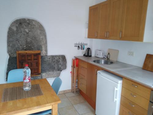 a small kitchen with a sink and a counter top at Casa Gio in Arure