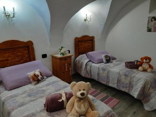 Katil atau katil-katil dalam bilik di L'Antica Canonica di Casa Bernardi, terrazzo Wi-Fi PetFriendly con Area Cani