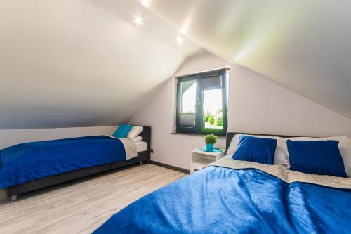 Postel nebo postele na pokoji v ubytování Hygge Domki
