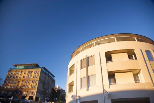a building with a dome on the side of it at Salamanca Terraces in Hobart