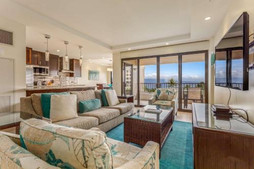 a living room with a couch and a table at Kaanapali Alii in Lahaina