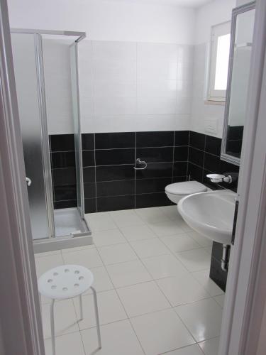 a bathroom with a shower and a sink and a toilet at Appartamenti STELLA MARINA- Posto Rosso in Alliste