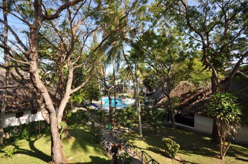 an aerial view of a resort with a pool and trees at Kilifi Bay Beach Resort in Kilifi