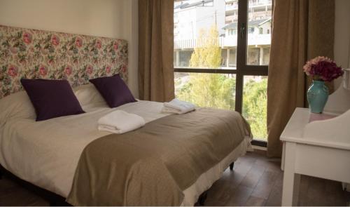 מיטה או מיטות בחדר ב-La Bonita Apartment